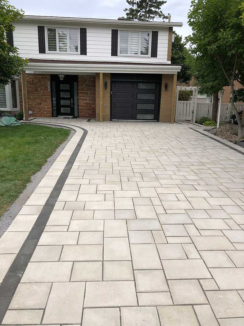 White and black combination pavers on the driveway